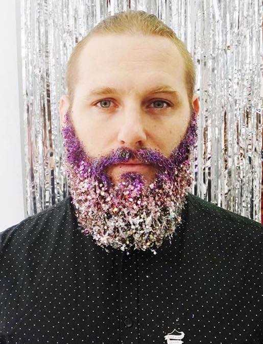 man with a purple glitter beard