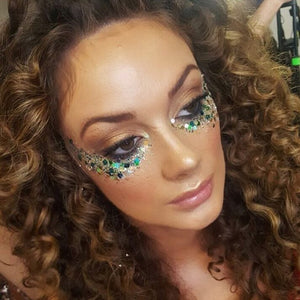 woman wearing the green and blue glitter pot under her eyes