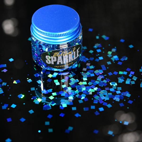 pot of blue face glitter sprinkled on a surface