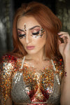 woman wearing a combination of orange and yellow glitter