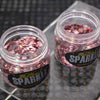 two pots of pale pink glitter