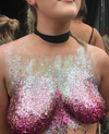 woman wearing hot pink glitter on her breasts 