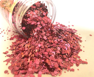 pink biodegradable glitter pouring out of pot