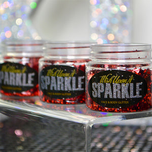 three tubs of red glitter