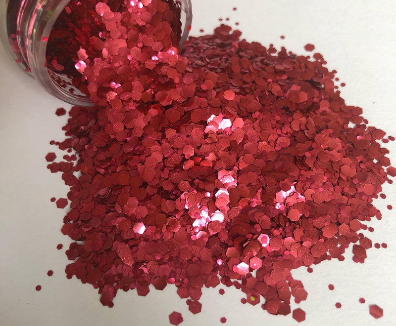 red biodegradable glitter pouring out of pot